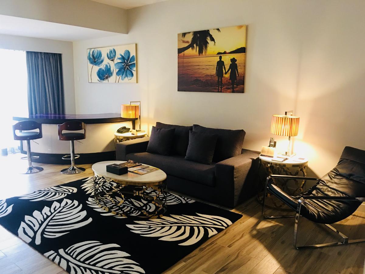 Sand&Sandals Desaru Beach Resort&Spa Bagian luar foto A living room in a hotel